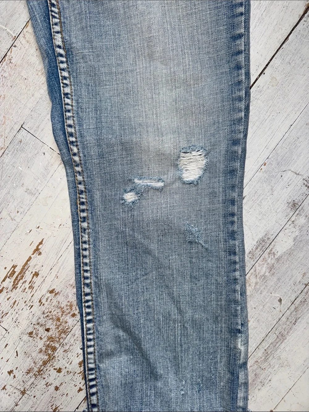 American Eagle Outfitters faded blue distressed jeans
